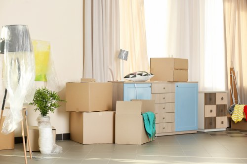 Removal team carefully handling boxes during a Catford move