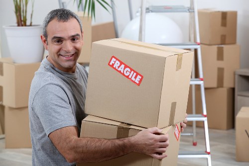 Local movers handling office furniture during a Catford business relocation