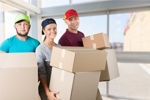Professional movers handling office relocation equipment in Catford