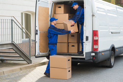 Movers handling sofas, beds, and household furniture in Catford