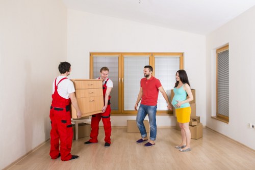 Household furniture being carefully transported by Catford movers