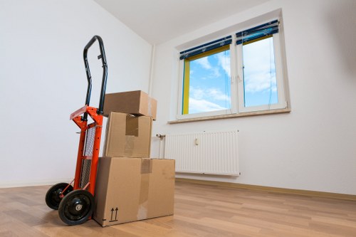 A moving van prepared for a flat removal in Catford near residential buildings